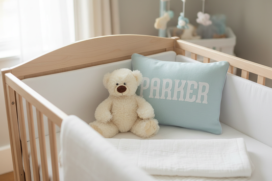 Adair Applique Baby Pillow on crib