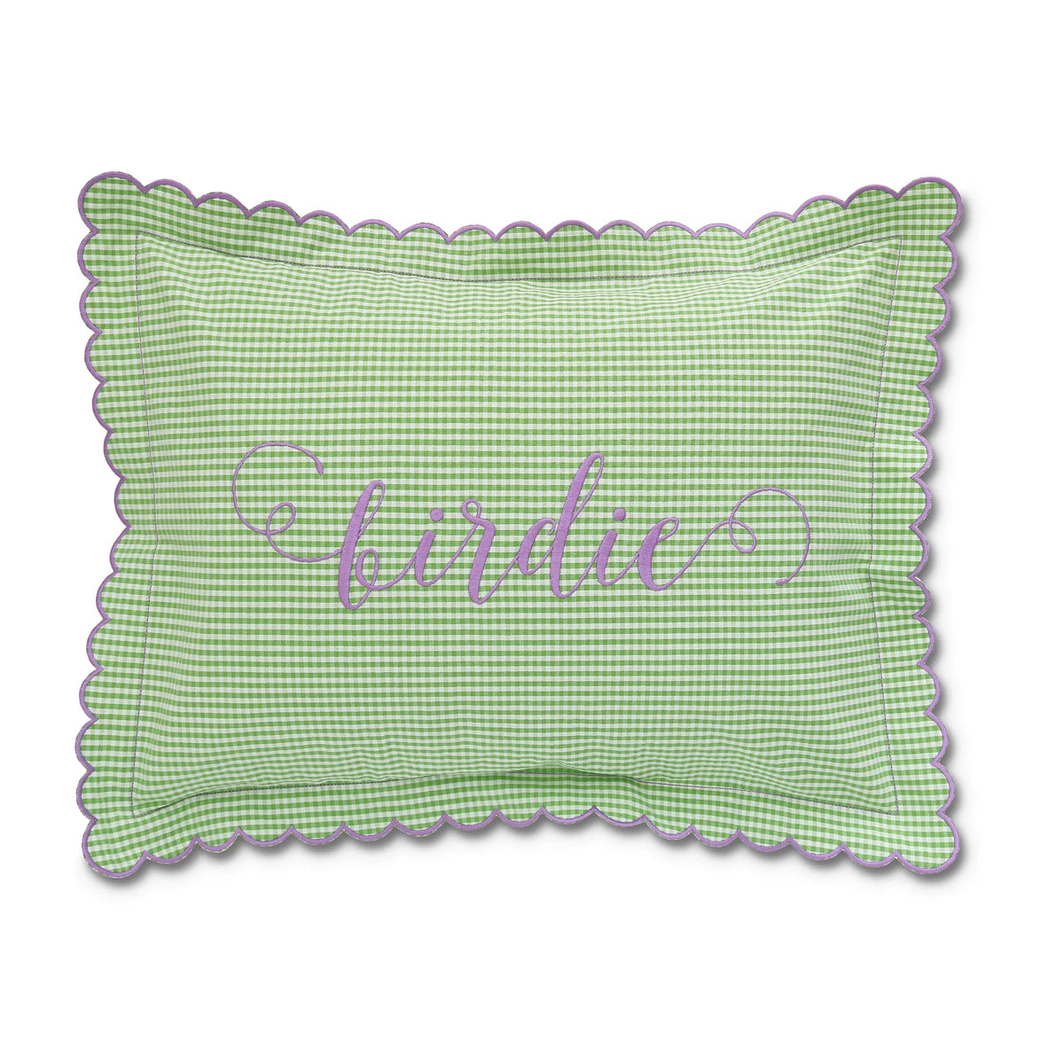 A green and white seersucker cotton fabric boudoir sham with scalloped edges and the name 'birdie' monogrammed in purple.