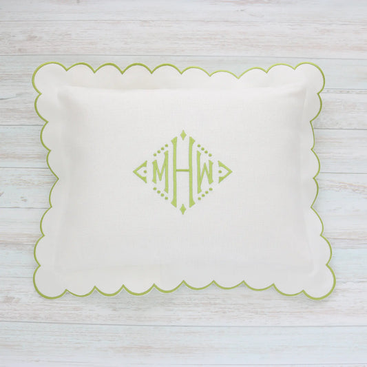 White pillow with green scalloped edge and monogram MHW in sage green handmade by Cora's Linen