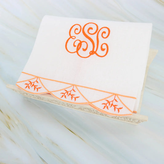 Branches inside Clara scalloped edge guest towel in orange with monogram ESL made by Cora's Linen
