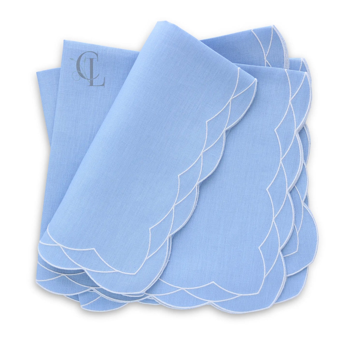 Set of Cosmo bluebell napkins with white scalloped edges on a white background, featuring the brand 'Cora's Linen'.