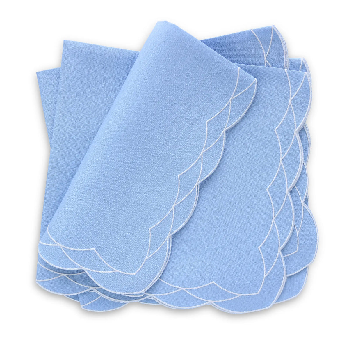 Set of Cosmo bluebell napkins with white scalloped edges on a white background, featuring the brand 'Cora's Linen'.