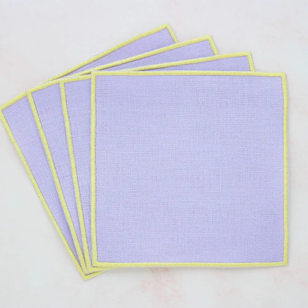lavender straight edge Turin cocktail napkin set of 4, arranged in an overlapping fan pattern, handmade by Cora's Linen