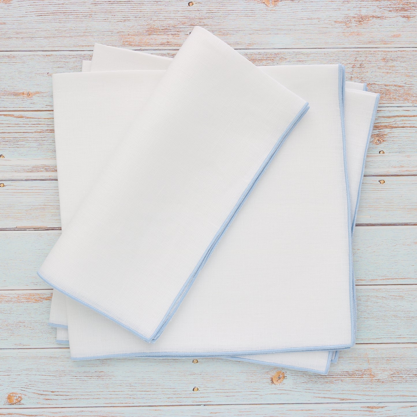 White Linen Dinner Napkins with Light Blue Edge (each)