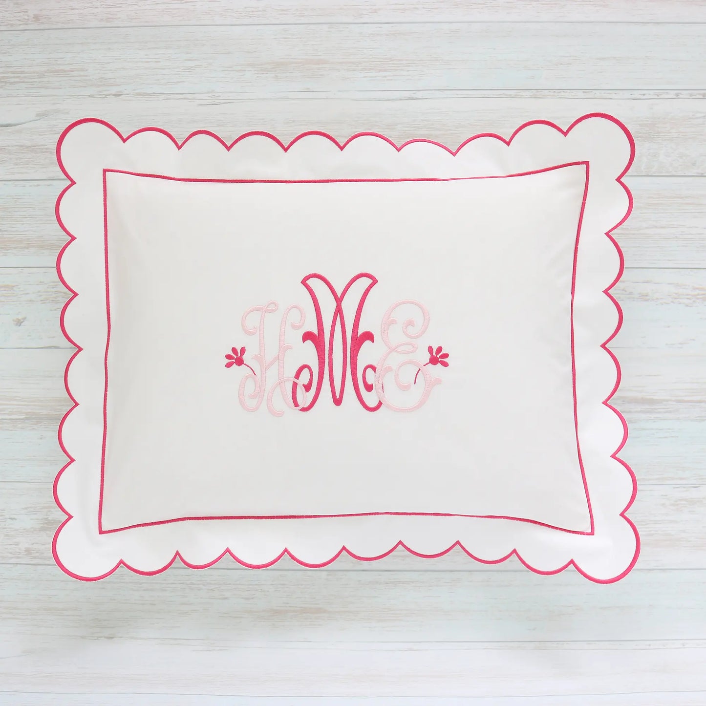 White percale boudoir sham with monogram Camellia in shades of pink