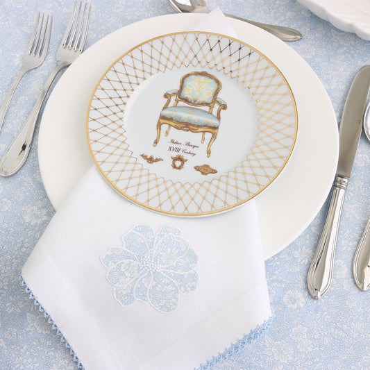 white napkin with a liberty print applique hibiscus flower and picot trim