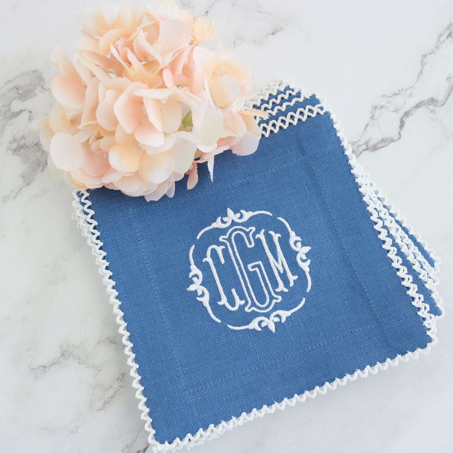 Buckley monogram CGM on a Denim Blue Cocktail Napkin and White picot trim