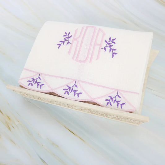 Branches inside Clara scalloped edge guest towel in purple with monogram KDA made by Cora's Linen