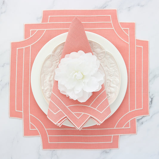 coral embroidered Mateo placemat with matching dinner napkin place setting