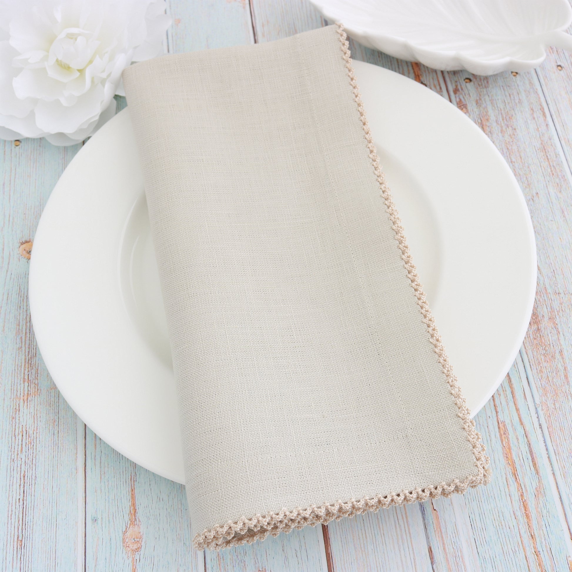 place setting with Sand linen napkin and Natural picot trim