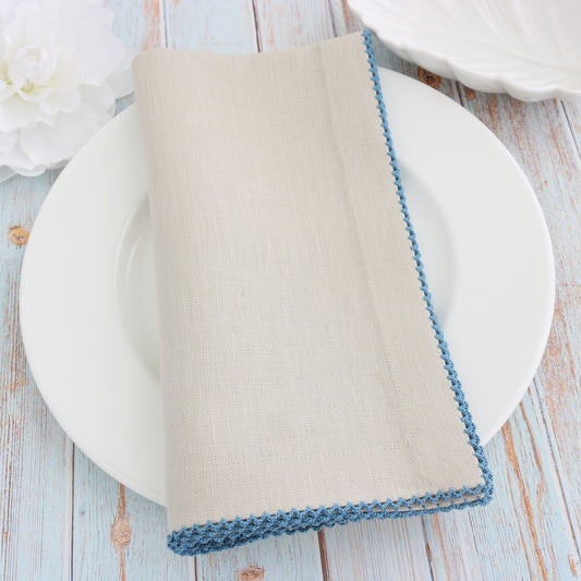 place setting with Sand linen napkin and Paradise Blue picot trim