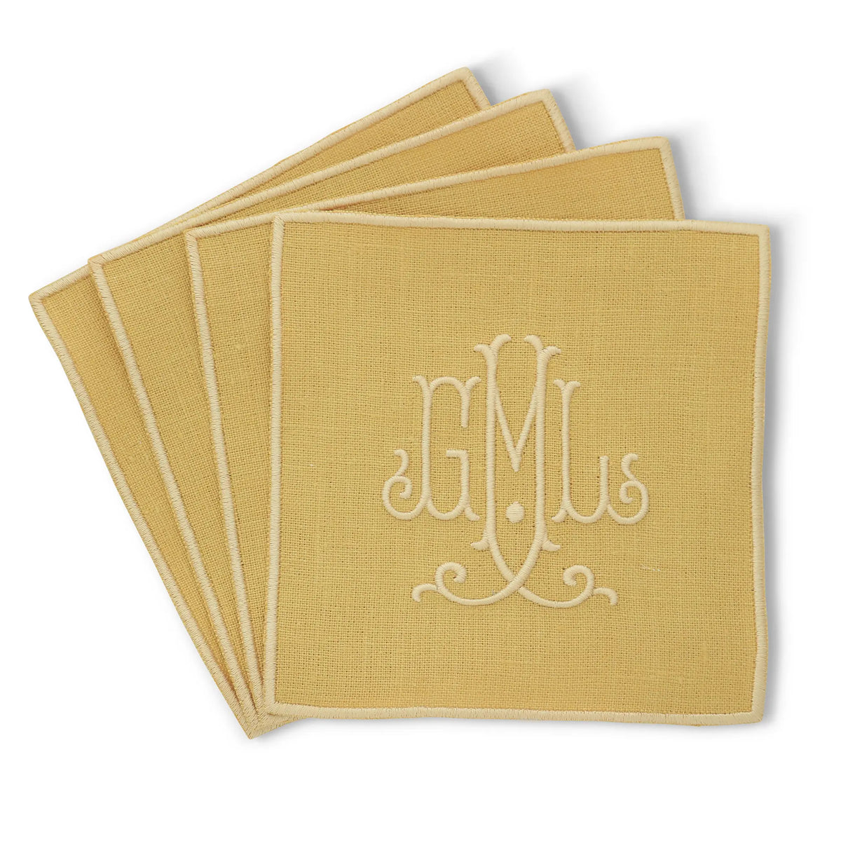 citron straight edge Turin cocktail napkin set of 4, arranged in an overlapping fan pattern with monogram GML, handmade by Cora's Linen