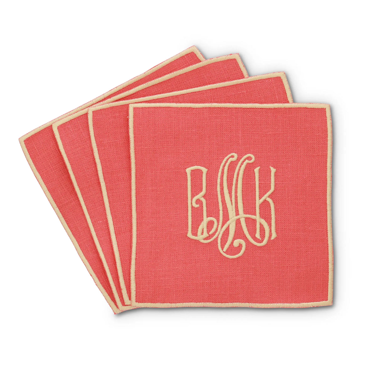 coral straight edge Turin cocktail napkin set of 4, arranged in an overlapping fan pattern with monogram BMK, handmade by Cora's Linen