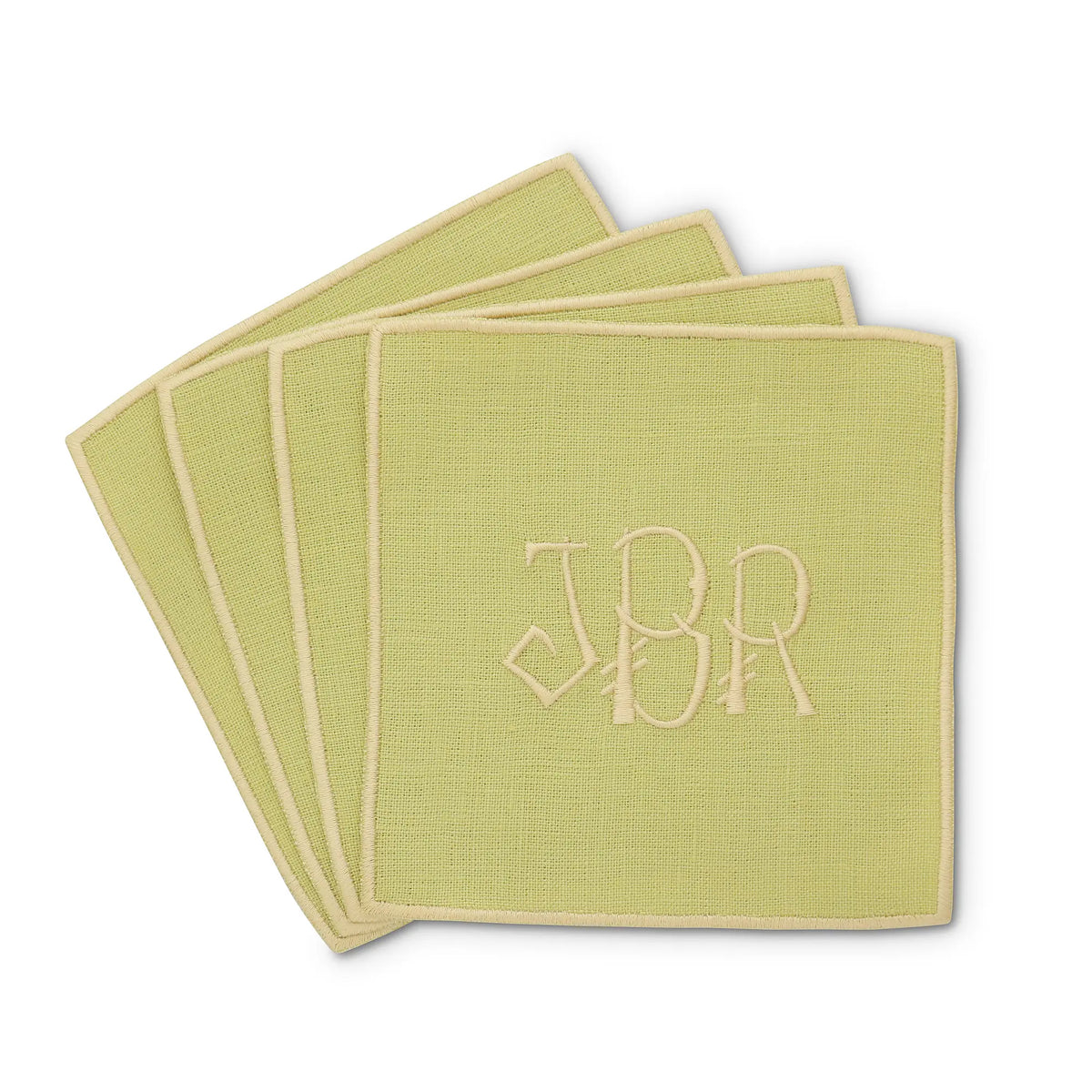 green straight edge Turin cocktail napkin set of 4, arranged in an overlapping fan pattern with monogram JBR, handmade by Cora's Linen