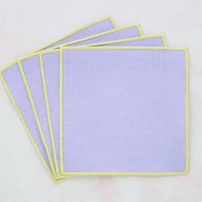 lavender straight edge Turin cocktail napkin set of 4, arranged in an overlapping fan pattern, handmade by Cora's Linen
