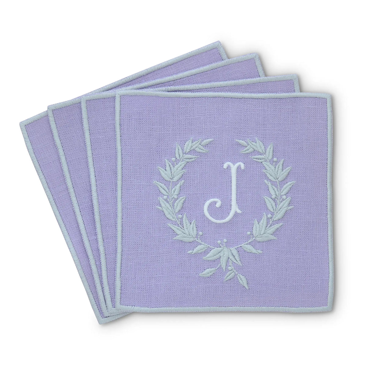 lavender straight edge Turin cocktail napkin set of 4, arranged in an overlapping fan pattern with monogram J, handmade by Cora's Linen