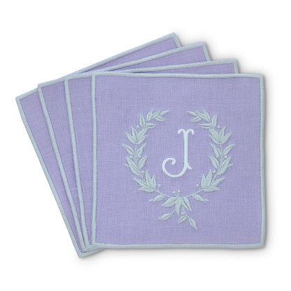 lavender straight edge Turin cocktail napkin set of 4, arranged in an overlapping fan pattern with monogram J, handmade by Cora's Linen