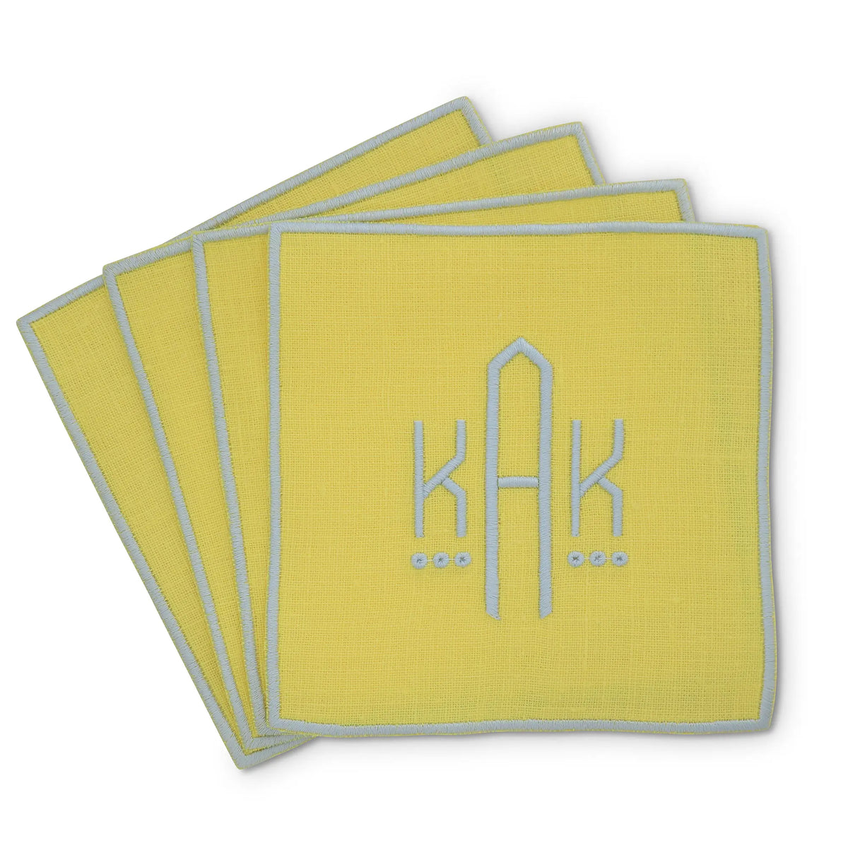 yellow straight edge Turin cocktail napkin set of 4, arranged in an overlapping fan pattern with monogram KAK, handmade by Cora's Linen