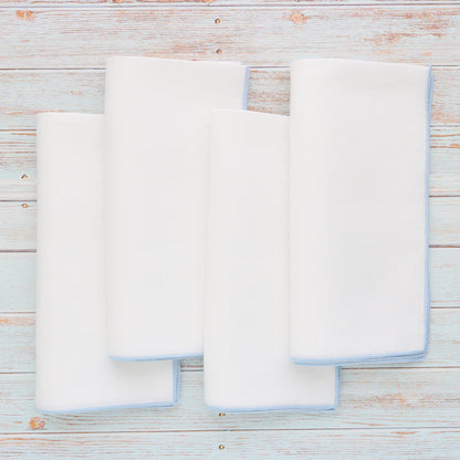 Serviettes de table en lin blanc avec bord bleu clair (lot de 4)