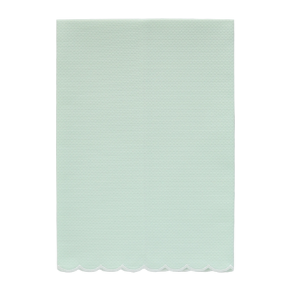 A mint green pique fingertip towel with a natural white scalloped edge