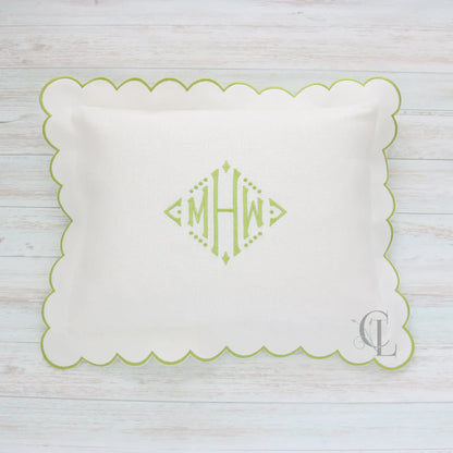 White pillow with green scalloped edge and monogram MHW in sage green handmade by Cora's Linen