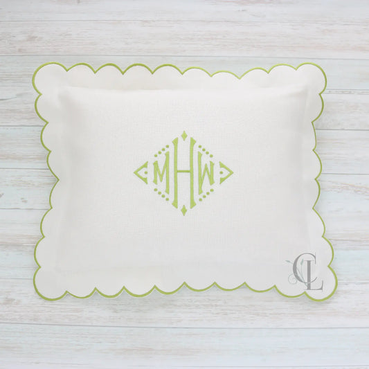 White pillow with green scalloped edge and monogram MHW in sage green handmade by Cora's Linen