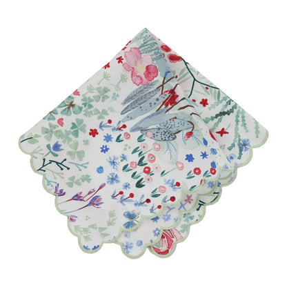 Set of floral patterned scalloped handkerchiefs on a white background