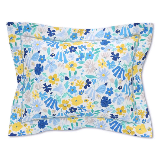 Floral-patterned Liberty London Sketchbook Bloom pillowcase with blue, yellow, and white flowers on a white background