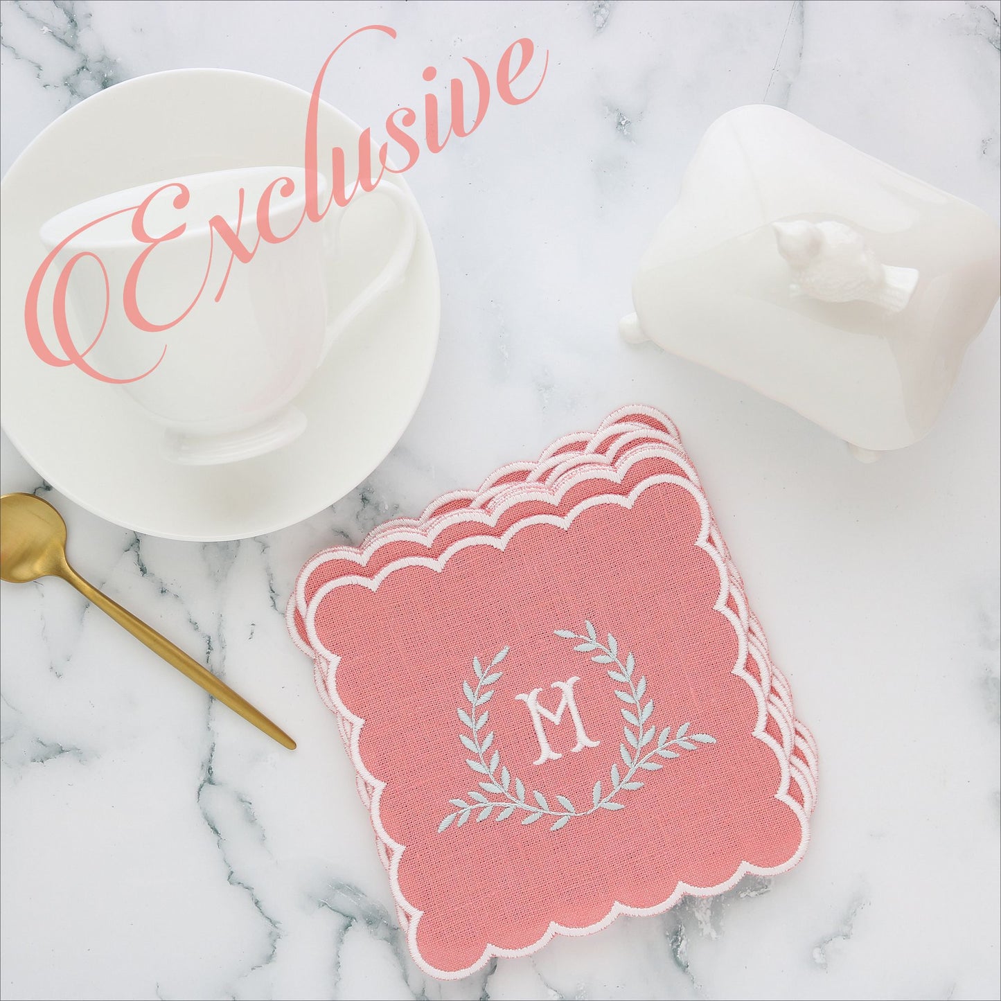 Salmon linen cocktail napkin with white scallops and Napoleon monogram M in White